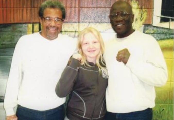 Albert Woodfox (left) and Herman Wallace (right) with an 11 year old British visitor, Poppy Richards.