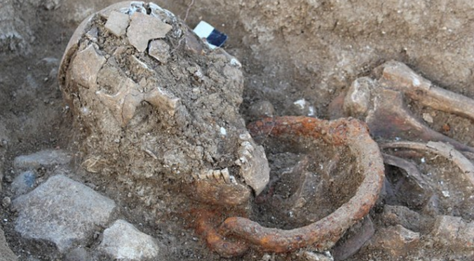 Buried in chains – a Roman-era skeleton, thought to be that of a male slave, excavated near Bordeaux. The body was buried with shackles around the neck, and dates from the 1st century AD.