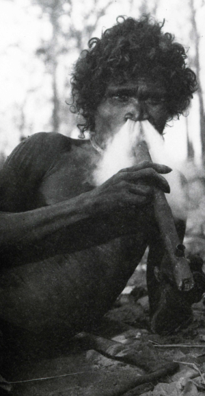 A man of the Narana tribe smokes a Makassan pipe.